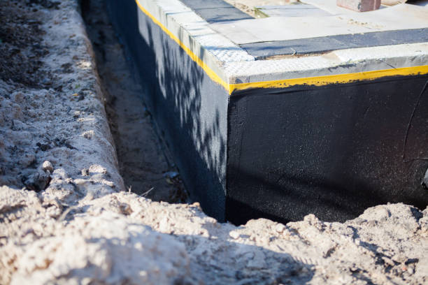 Professional Waterproofing technician working in Samaria, MI